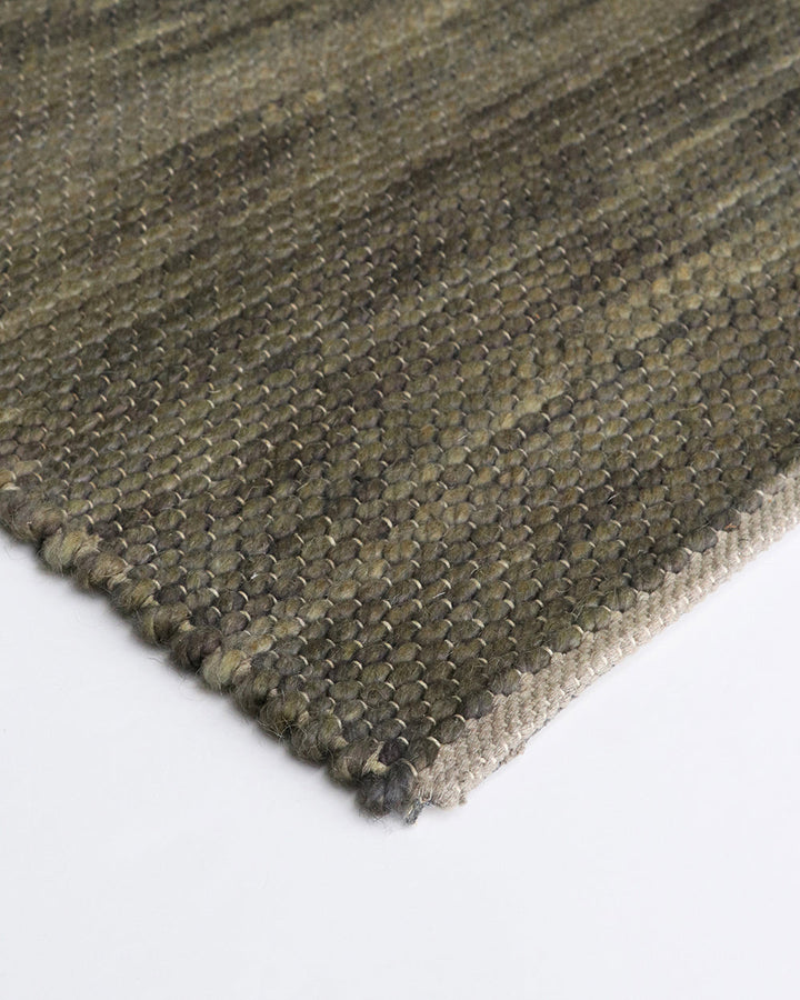 Boardwalk Floor Rug Immerse yourself in theÂ moodyÂ green tones of our Boardwalk floor rug. Space-dyed fibres of wool and cotton form a mottled pattern reminiscent of forest foliage. Rustic, with a refined feel, the Boardwalk invites us to create nurturin