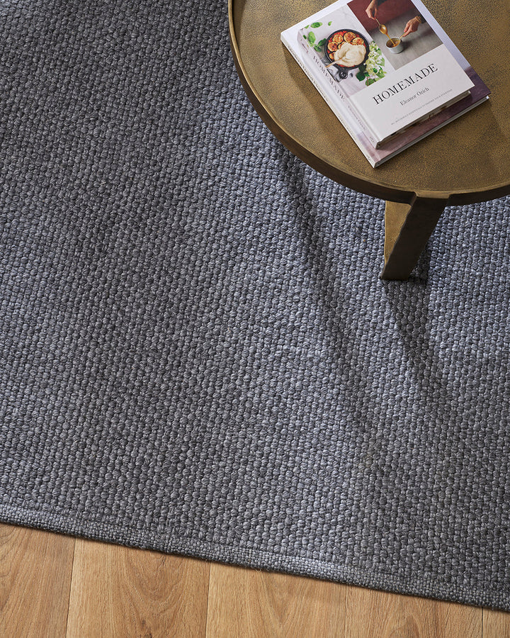 Burleigh Floor Rug Create a relaxed exterior setting with understated texture and soft charcoal tones. With the look and feel of an indoor rug, the Burleigh’s sustainable composition makes this an eco-friendly choice for refined exterior space. This piece