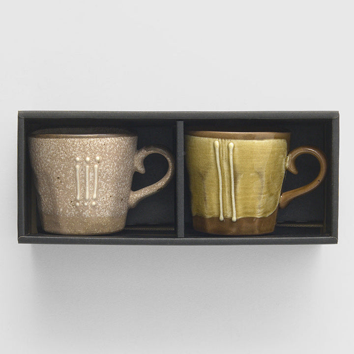 Mug set featuring two earth tone glazed cups in a stylish box, perfect for modern tableware.
