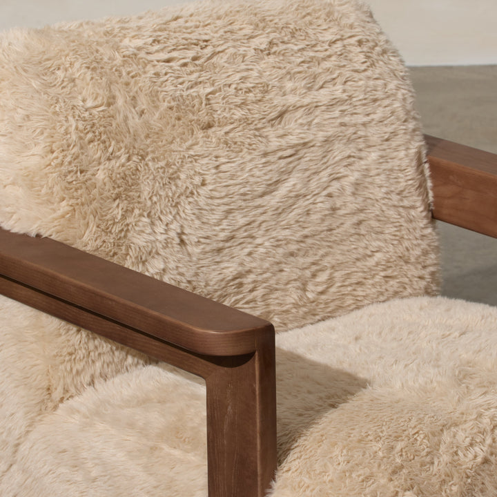 Corwin Occasional Chair Yakety Yak Our Corwin Occasional Armchair is mid-century inspired statement piece that blends sculptural elegance and grounded design. This unique upholstere chair features wooden arms that seamlessly extend into the base, eliminat