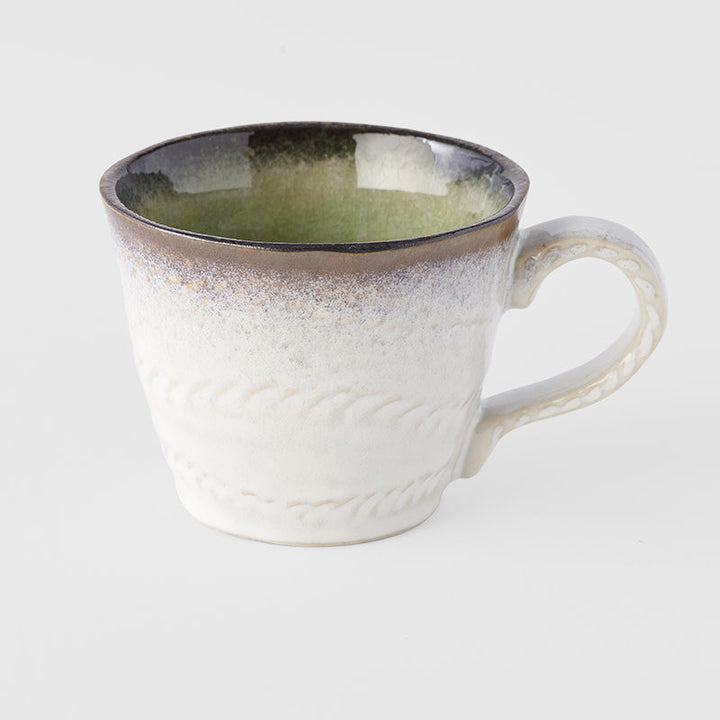 Lime green glazed mug with artisan texture, 9.2 cm and 220 ml capacity, inspired by wabi sabi culture.