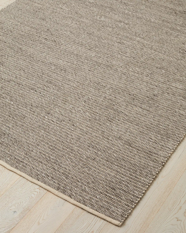 Andes Feather One of our most popular rugs, Andes is a hand-woven textured floor rug featuring a ribbed design — the range bringing a coastal vibe with beautiful visual interest. Made from 50% Wool and 50% Cotton, Andes uses chunky spun wool yarn and warp
