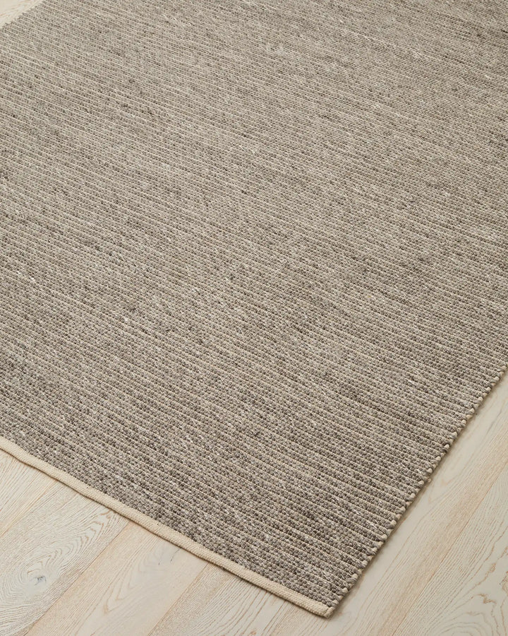 Andes Feather One of our most popular rugs, Andes is a hand-woven textured floor rug featuring a ribbed design — the range bringing a coastal vibe with beautiful visual interest. Made from 50% Wool and 50% Cotton, Andes uses chunky spun wool yarn and warp