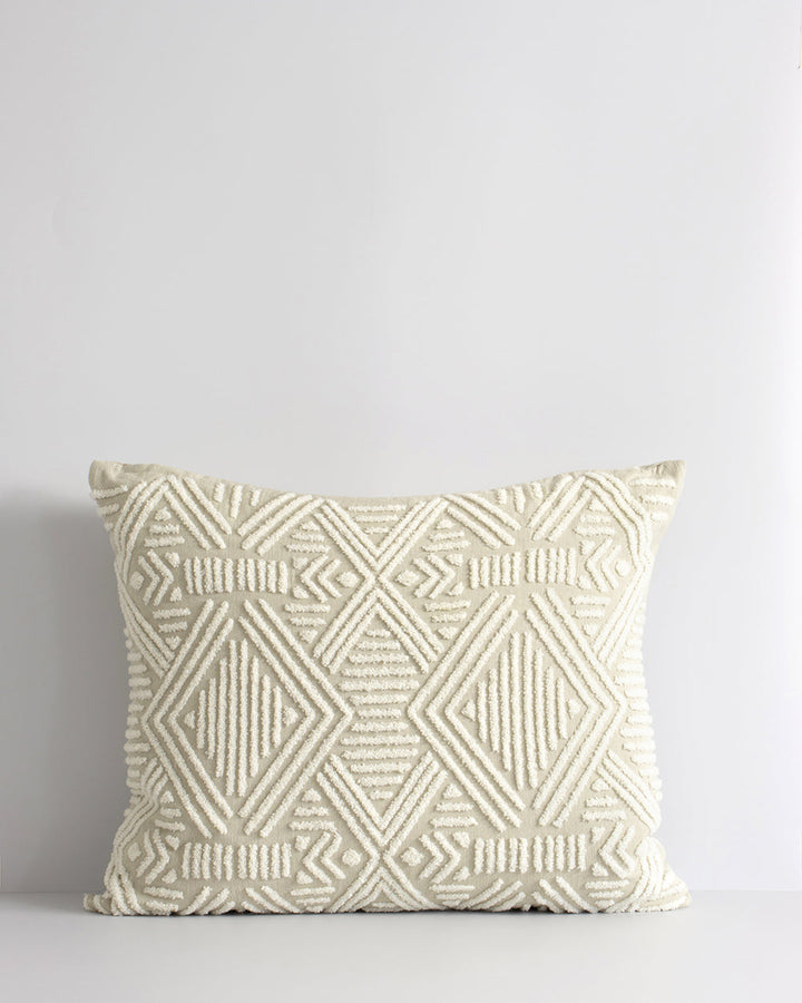 Cassius Cushion Tufted embroidery on a natural base forms the texture on this relaxed and expressive cushion. Centred on a serene colour palette of ecru and taupe, the subtly tribal surface design looks great paired with finely woven linens in neutral and