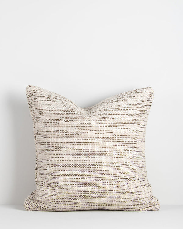 Chandler Cushion Create an outdoor sanctuary with the pared-back design of our Chandler cushion. Handwoven in a textural two-tone yarn, the simple design and soft colourway make the perfect combination for easy summer living. This piece works just as well