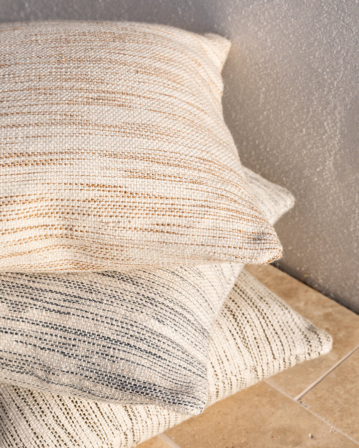 Chandler Cushion Create an outdoor sanctuary with the pared-back design of our Chandler cushion. Handwoven in a textural two-tone yarn, the simple design and soft colourway make the perfect combination for easy summer living. This piece works just as well