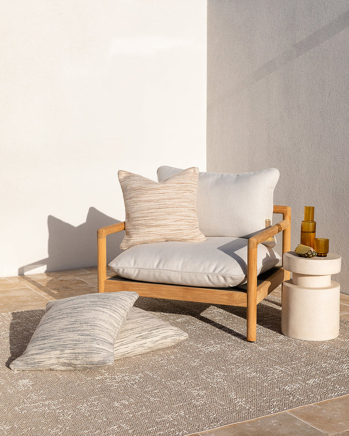 Chandler Cushion Create an outdoor sanctuary with the pared-back design of our Chandler cushion. Handwoven in a textural two-tone yarn, the simple design and soft colourway make the perfect combination for easy summer living. This piece works just as well