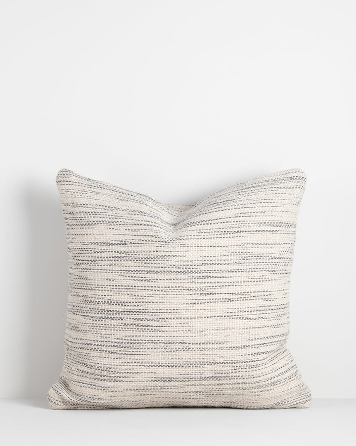 Chandler Cushion Create an outdoor sanctuary with the pared-back design of our Chandler cushion. Handwoven in a textural two-tone yarn, the simple design and soft colourway make the perfect combination for easy summer living. This piece works just as well