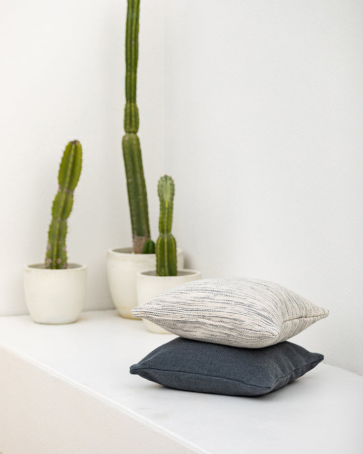 Chandler Cushion Create an outdoor sanctuary with the pared-back design of our Chandler cushion. Handwoven in a textural two-tone yarn, the simple design and soft colourway make the perfect combination for easy summer living. This piece works just as well