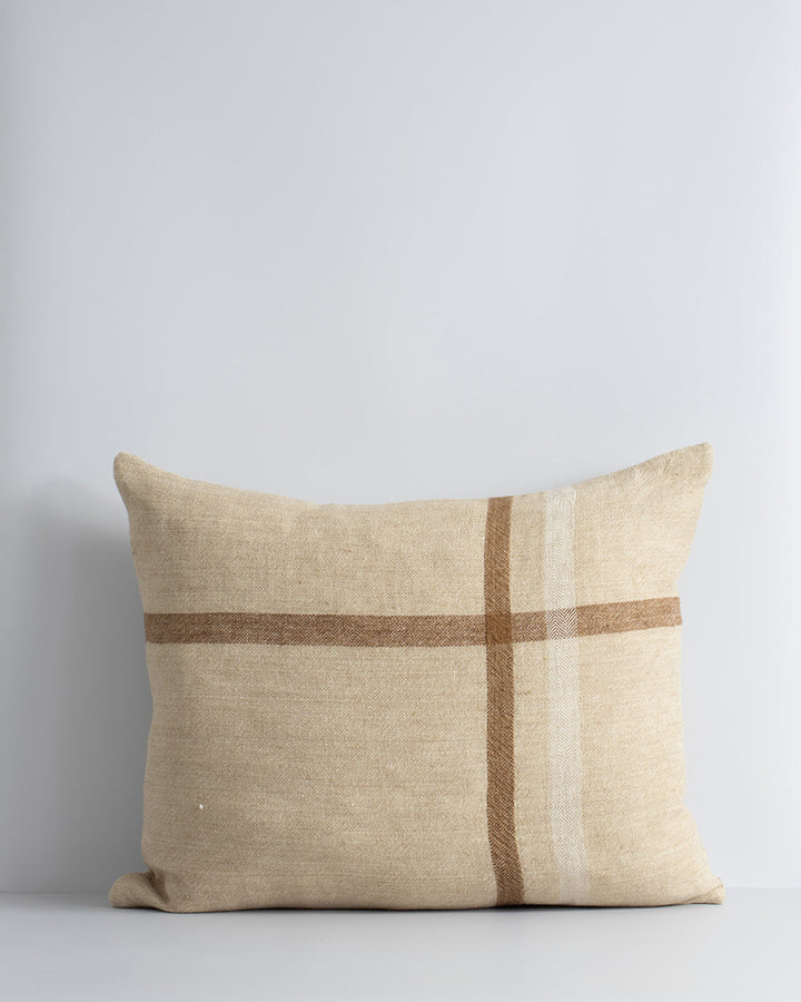 Clintock Cushion Country charm is reinterpreted for urban living in the pared-back design of our Clintock cushion. Tones of treacle, ivory and taupe are woven into an offset, oversized plaid, embodying the â€˜Rustic Retreatâ€™ trend. Comfort and quality g