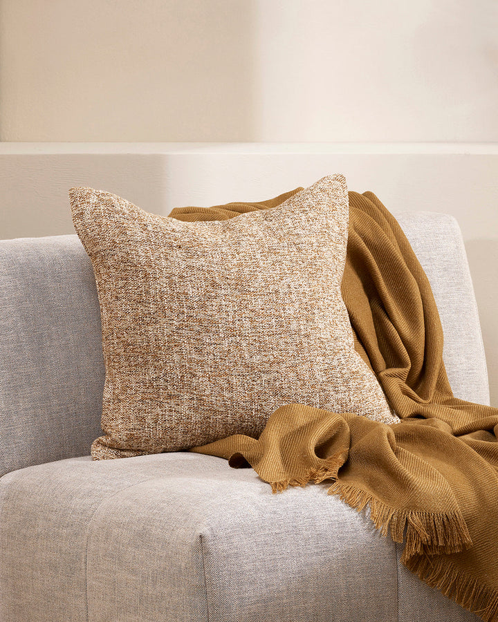 Cumbria Cushion Earthy colourways of marled yarn create the subtle tone of our Cumbria cushion. Handwoven in shades of dijon and ecru, the texture and soft mottled effect makes this a timeless piece for a grounded and restorative interior. Use as a pairin