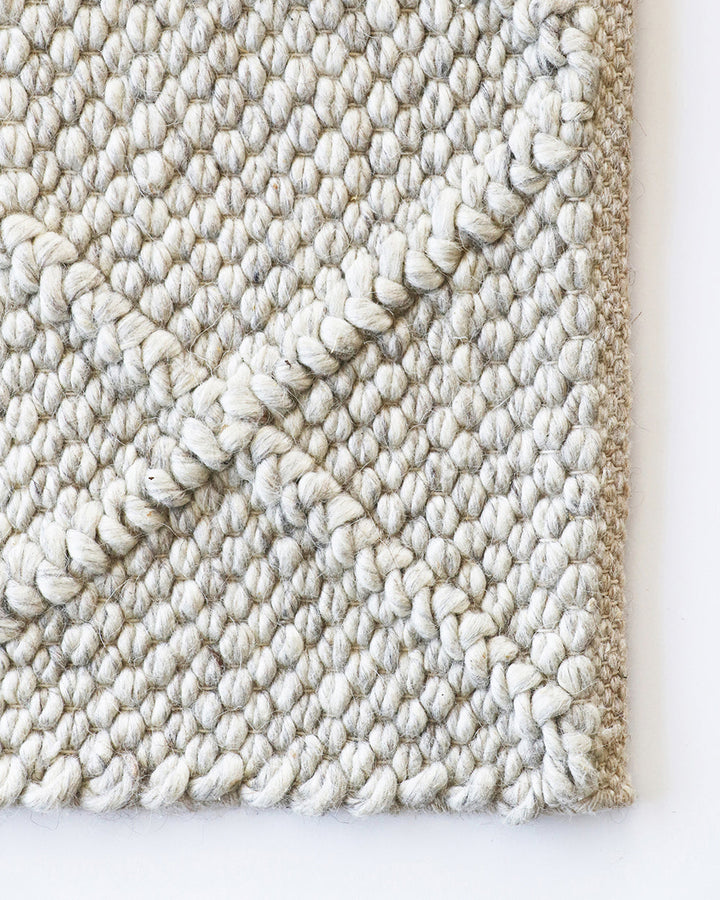 Dakota Floor Rug A staple for contemporary living, the Dakota is a superbly versatile piece. Handwoven in a classic diamond pattern, the natural straw tone and wool-blend composition brings beautiful warmth and texture to living spaces. Australian Stock B