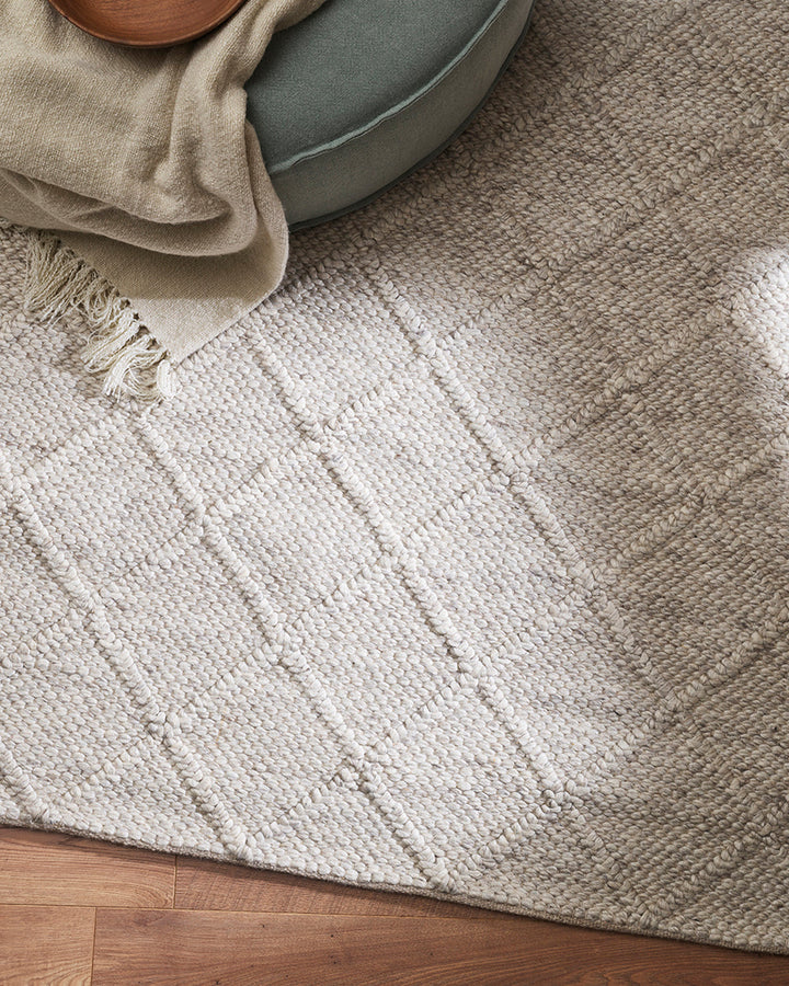 Dakota Floor Rug A staple for contemporary living, the Dakota is a superbly versatile piece. Handwoven in a classic diamond pattern, the natural straw tone and wool-blend composition brings beautiful warmth and texture to living spaces. Australian Stock B