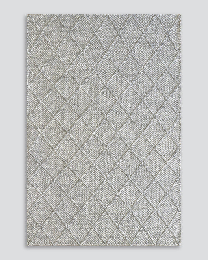 Dakota Floor Rug A staple for contemporary living, the Dakota is a superbly versatile piece. Handwoven in a classic diamond pattern, the natural straw tone and wool-blend composition brings beautiful warmth and texture to living spaces. Australian Stock B