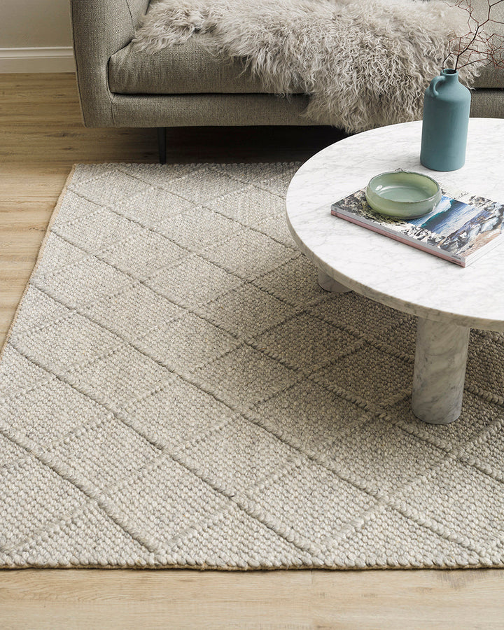 Dakota Floor Rug A staple for contemporary living, the Dakota is a superbly versatile piece. Handwoven in a classic diamond pattern, the natural straw tone and wool-blend composition brings beautiful warmth and texture to living spaces. Australian Stock B