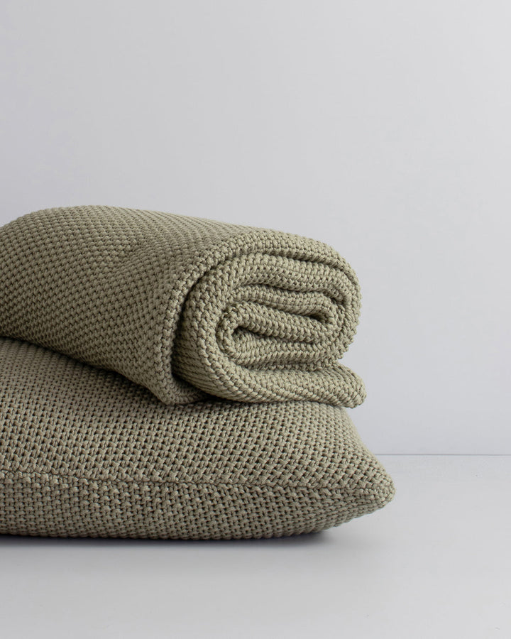 Devon Cushion Retreat into the comfort of this beautifully textured, organic cotton knit cushion. A classic and versatile accessory to any room, the soft texture and calming sage tone offers an unparalleled sense of warm, inviting style. Australian Stock