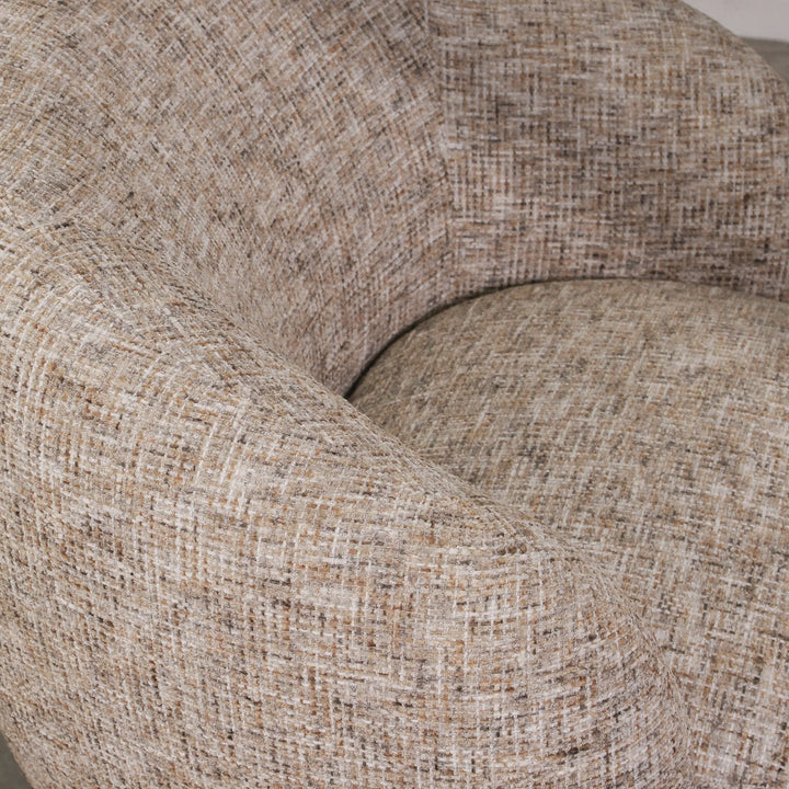 Aslan Occasional Chair Stone The Aslan Occasional Chair invites you to sink into plush comfort with its curved silhouette and soft, textured upholstery. This chair introduces a vibrant, multi-coloured fabric that adds bold personality while maintaining a