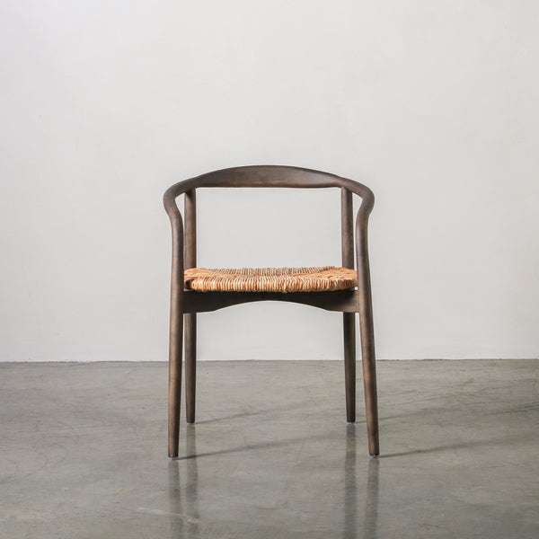 Essence Dining Chair Leaf Rope/Smoke with a gracefully arched Ash wood frame and woven leaf rope seat.