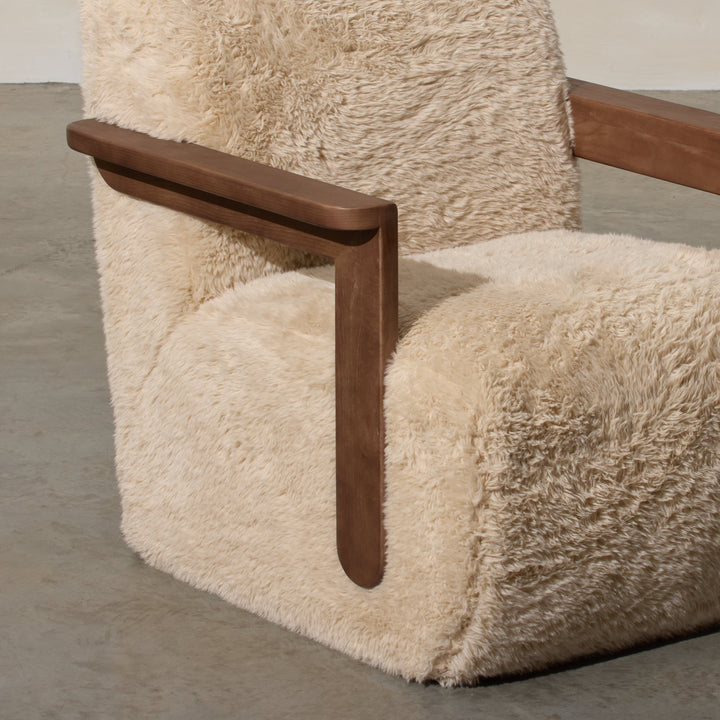 Corwin Occasional Chair Yakety Yak Our Corwin Occasional Armchair is mid-century inspired statement piece that blends sculptural elegance and grounded design. This unique upholstere chair features wooden arms that seamlessly extend into the base, eliminat