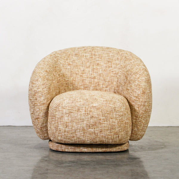 Aslan Occasional Chair Honey The Aslan Occasional Chair invites you to sink into plush comfort with its curved silhouette and soft, textured upholstery. This chair introduces a vibrant, multi-coloured fabric that adds bold personality while maintaining a