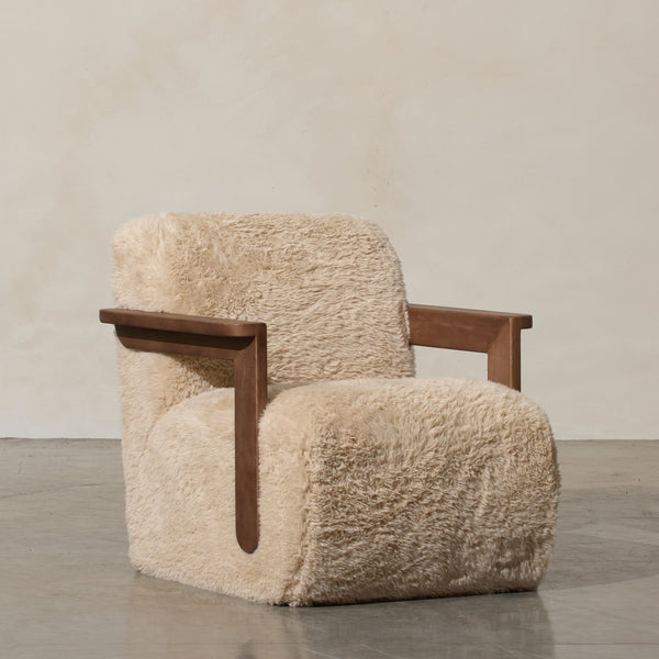 Corwin Occasional Chair Yakety Yak Our Corwin Occasional Armchair is mid-century inspired statement piece that blends sculptural elegance and grounded design. This unique upholstere chair features wooden arms that seamlessly extend into the base, eliminat