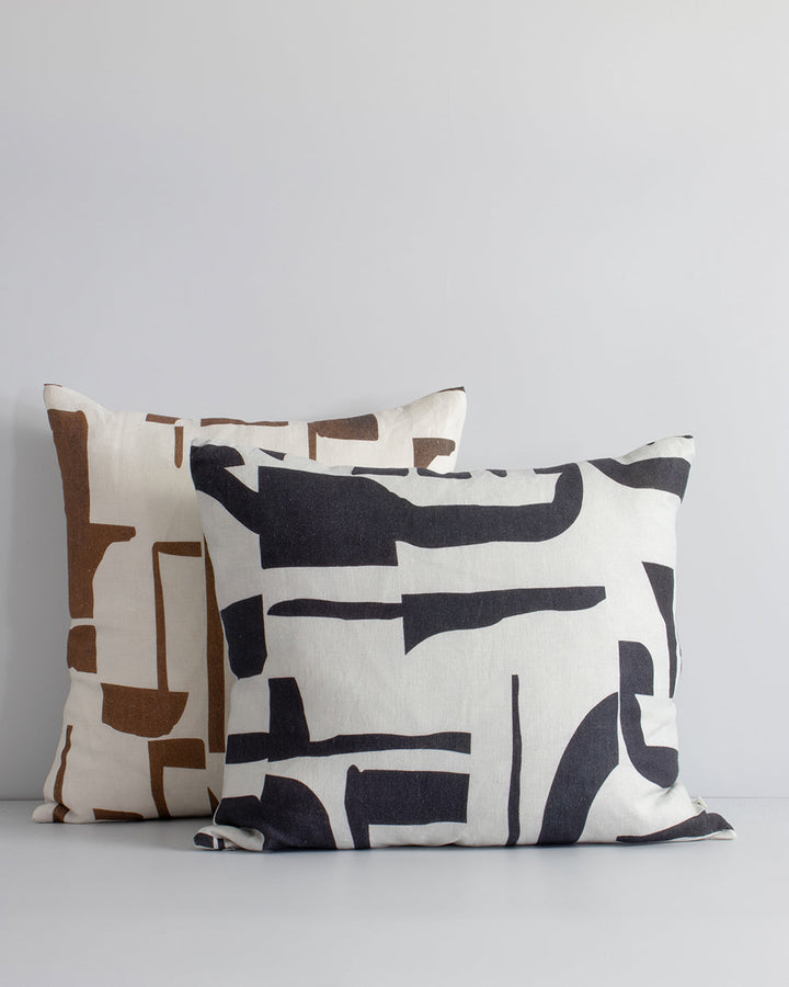 Elle Cushion Inspired by modernist forms, the design here is confident with off-beat copper shapes arranged on a pure linen base. Hand-painted by our in-house design team, this elegant and expressive cushion pairs well with brown or green-toned core produ