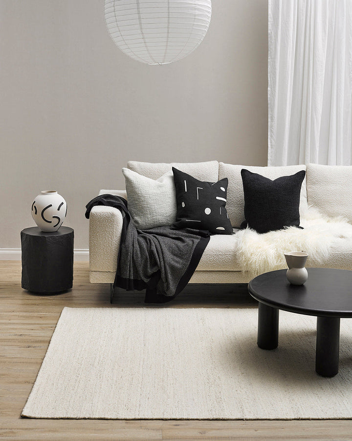 Emile Cushion Expressive, purposeful design meets our desire for stylish, contemporary living in this Joan Miro inspired design. With a nod to contemporary monochrome, minimal shapes are embroidered onto a pure linen base for a refined yet dramatic look.