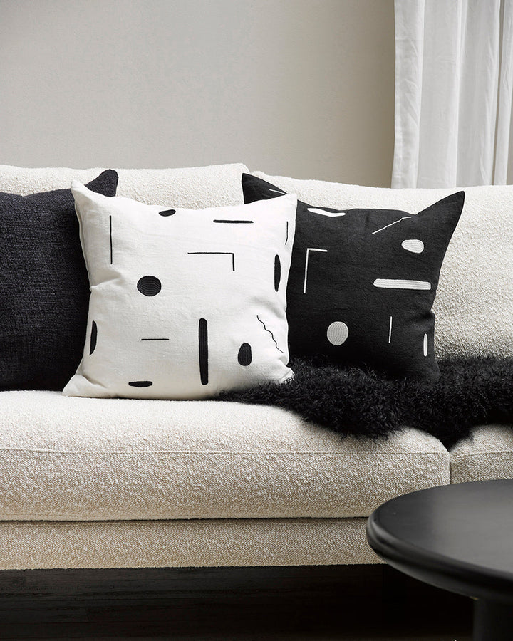 Emile Cushion Expressive, purposeful design meets our desire for stylish, contemporary living in this Joan Miro inspired design. With a nod to contemporary monochrome, minimal shapes are embroidered onto a pure linen base for a refined yet dramatic look.