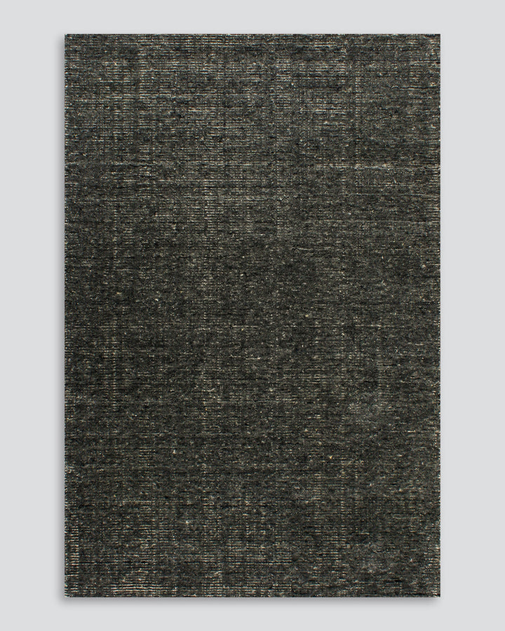 Emmett Floor Rug An understated floor rug that is both simple and luxurious. The Emmett is hand-knotted from 100% wool, creating a soft minimal pile. Featuring a fine linear pattern with a lighter base tone, this floor rug is perfect for crafting a refine