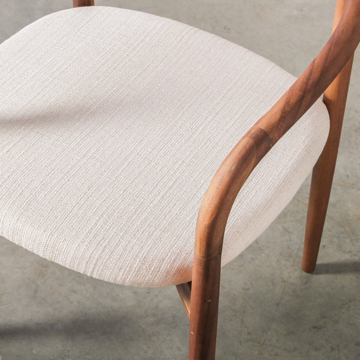 Essence Dining Chair Fabric/Walnut close-up of fabric upholstery and walnut frame