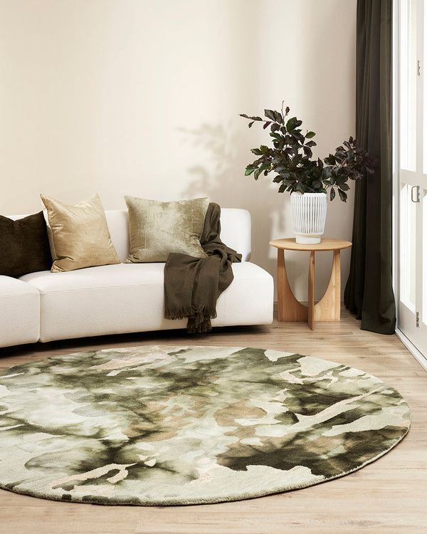 Fayette Round Floor Rug Add a stunning focal point to your space with the distinct design of Fayette. Inspired by forms in nature, the unique patterning is achieved through a specialised over-dyeing process applied to a handtufted base. Handwoven in a sof