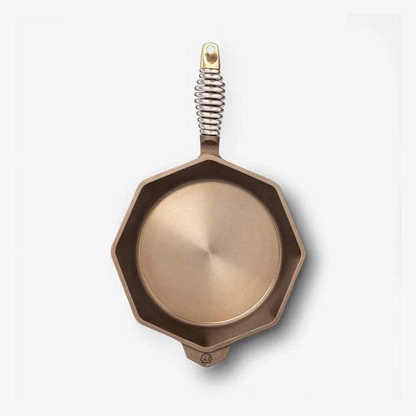 FINEX cast iron skillet with octagonal shape and polished surface, pre-seasoned for effortless cooking.