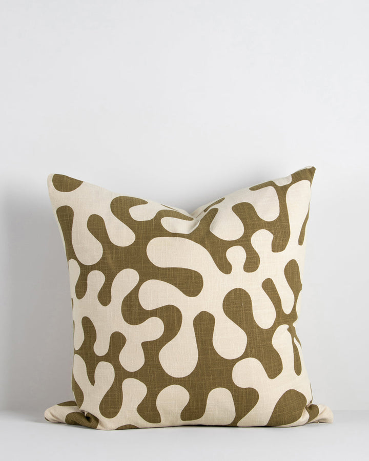 Forbici Cushion Inspired by 1950's jungle forms and Matisse, Forbici is a bold, confident design, with simplified leaf motifs screen-printed onto an ecru ground. Captured in a rich olive tone, this expressive piece is perfect for creating an interior brim