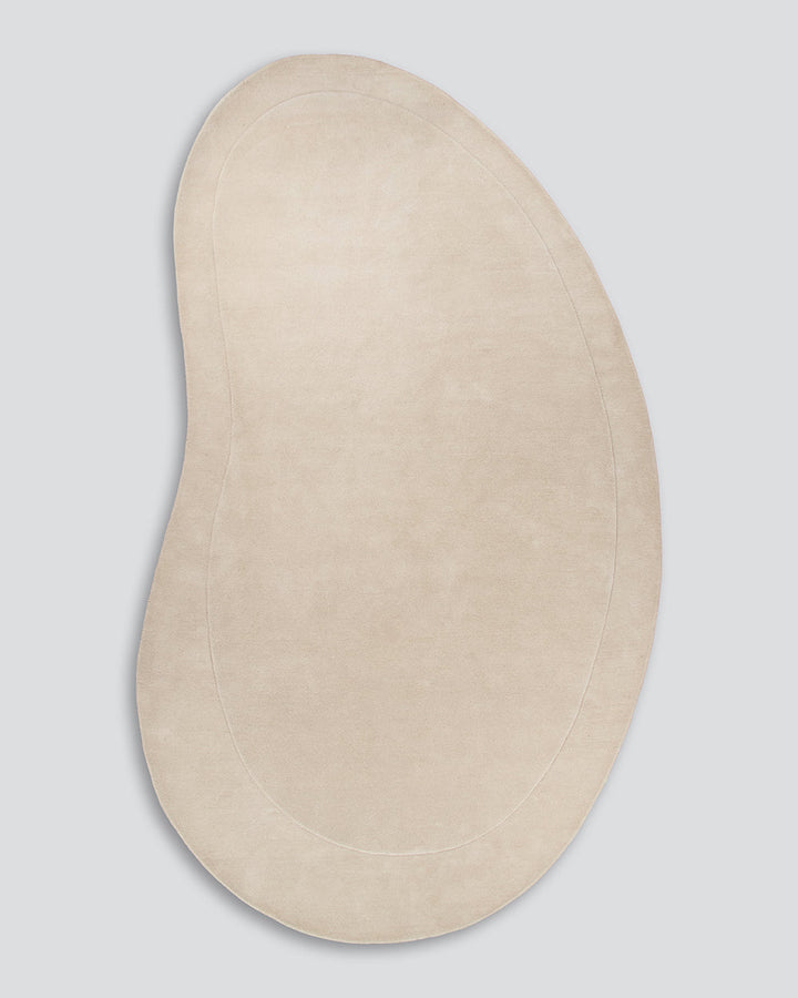 Form Floor Rug Add a stunning focal point to your space with the elegantly curved Form rug. Handtufted from 100% wool, the dense underfoot texture conveys a sense of luxury, while the cut-pile border adds dimension to the creamy, uniform base. Australian