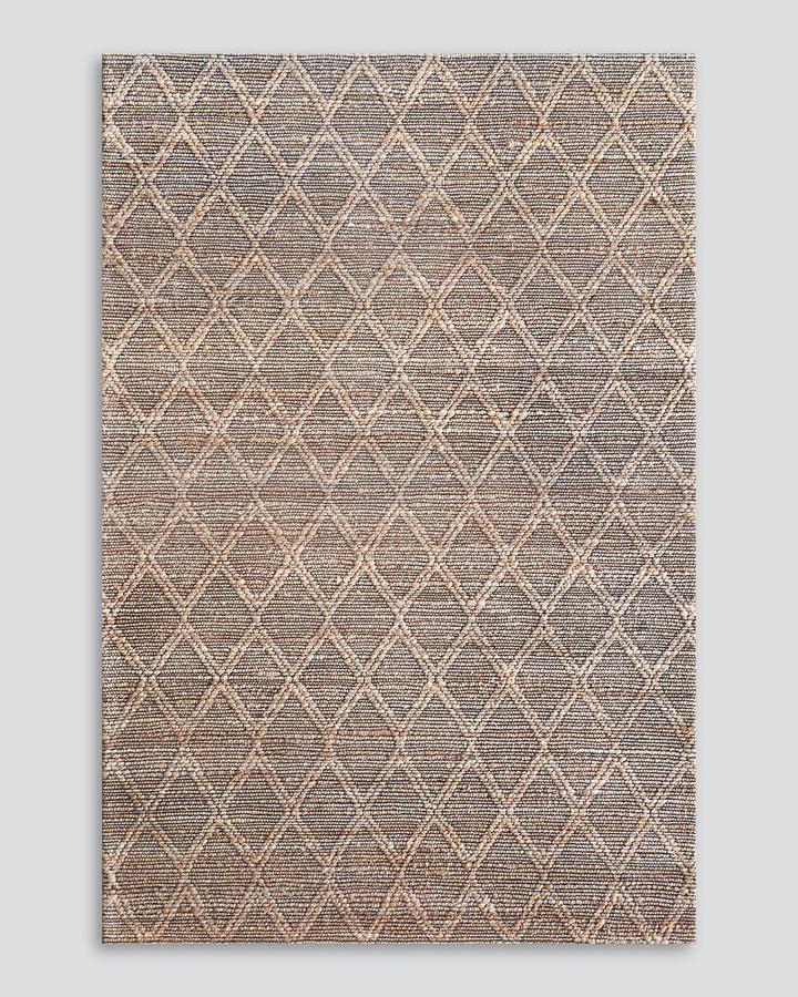 Genoa Floor Rug Create a welcoming space with the beauty of natural fibres. Inspired by dry landscapes, the handwoven texture and earthy tones of this piece bring a well-travelled feel to your space. Crafted from natural hemp fibre with black cotton detai