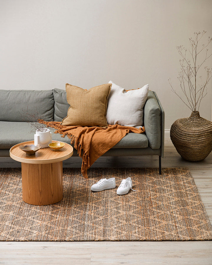 Genoa Floor Rug Create a welcoming space with the beauty of natural fibres. Inspired by dry landscapes, the handwoven texture and earthy tones of this piece bring a well-travelled feel to your space. Crafted from natural hemp fibre with black cotton detai