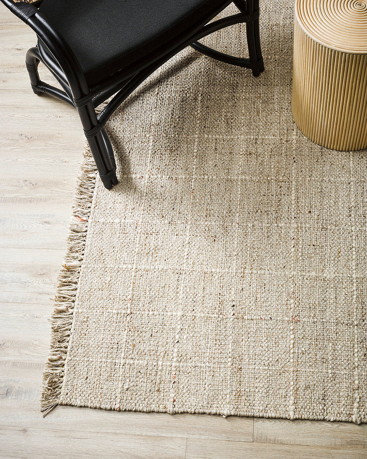 Gibson Floor Rug Handwoven by skilled artisans, our Gibson floor rug is crafted from a rich blend of wool and viscose. Tonal fibres are carefully interwoven with flecks of darker and lighter colourways, forming a subtle plaid pattern. The flatweave struct