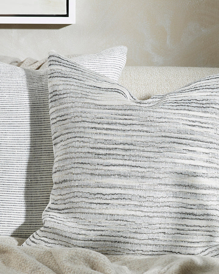 Himawari Cushion Simplicity reigns supreme in our beautifully pared-back Himawari cushion. Raw, slubby linen is handwoven into irregular fine charcoal stripes, while calm, natural tones and subtle surface texture creates a restful and restorative space. A