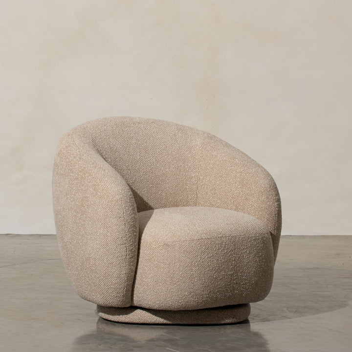 Aslan Occasional Chair Beige Immerse yourself in the plush embrace of our Aslan Occasional Chair and its soft, textured fabric and sink into a world of unmatched relaxation. The neutral tones and gracefully curved design contribute to a timeless yet uniqu