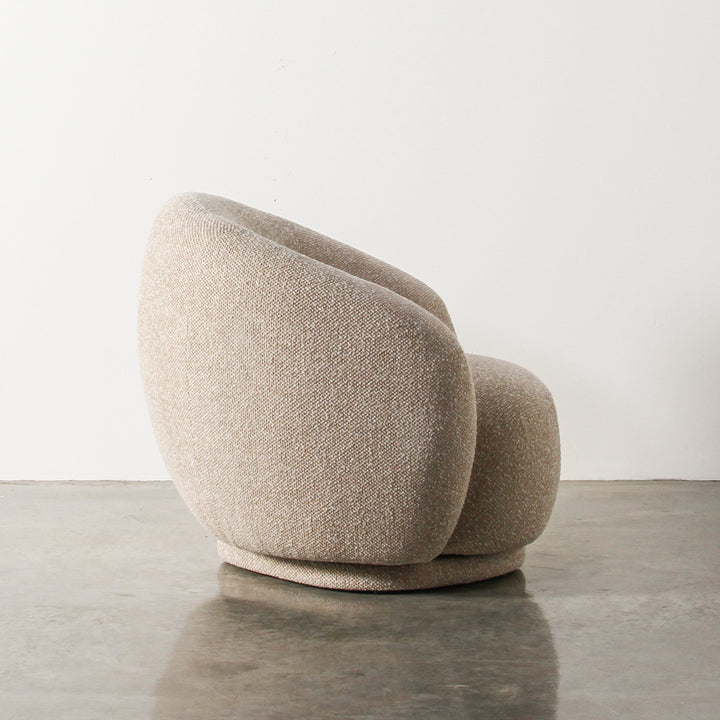 Aslan Occasional Chair Beige Immerse yourself in the plush embrace of our Aslan Occasional Chair and its soft, textured fabric and sink into a world of unmatched relaxation. The neutral tones and gracefully curved design contribute to a timeless yet uniqu