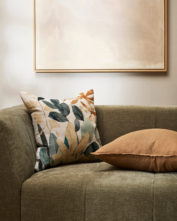 Imogen Cushion Botanical beauty is celebrated in the uplifting design of our Imogen cushion. Screen-printed onto a natural cotton base, overlaid cut-outs reminiscent of pressed flowers create a vibrant interplay of colour and shape. Warm tones of brass an