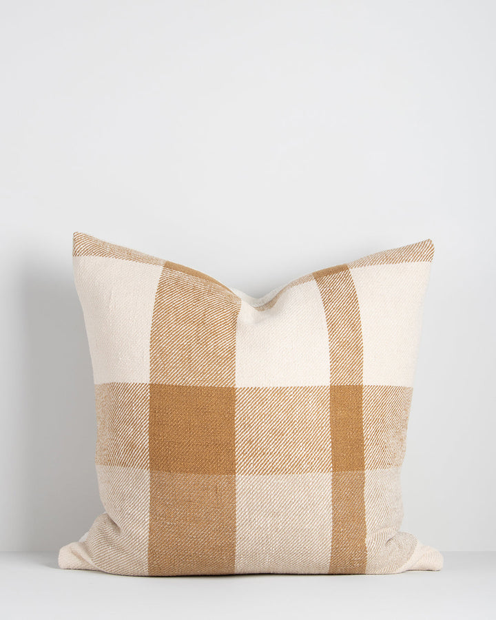 Jefferson Cushion Country charm is reinterpreted for urban living in the contemporary design of the Jefferson. Tones of cumin, ivory and tobacco are woven into an offset, oversized plaid design, embodying the modern country trend. Crafted from a thick cot