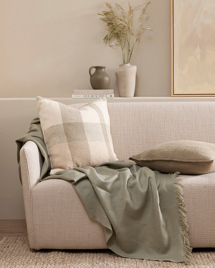 Jefferson Cushion Country charm is reinterpreted for urban living in the contemporary design of the Jefferson. Tones of cumin, ivory and tobacco are woven into an offset, oversized plaid design, embodying the modern country trend. Crafted from a thick cot