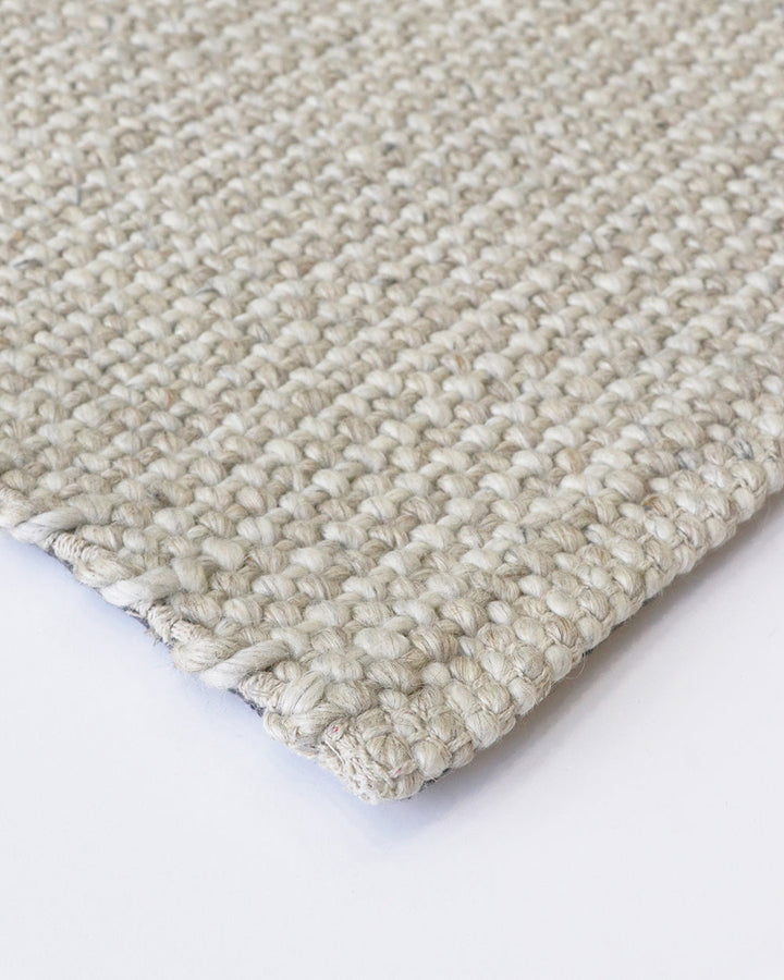 Kansas Floor Rug Bring a serene, welcoming feel to your home with the beauty of our Kansas floor rug. Handwoven in a two-tone blend of yarns, the simple 1-1 weave and soft oyster tones make this an easy choice for relaxed and minimal interiors. Australian