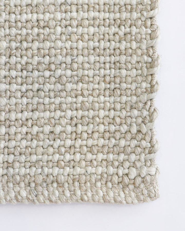 Kansas Floor Rug Bring a serene, welcoming feel to your home with the beauty of our Kansas floor rug. Handwoven in a two-tone blend of yarns, the simple 1-1 weave and soft oyster tones make this an easy choice for relaxed and minimal interiors. Australian