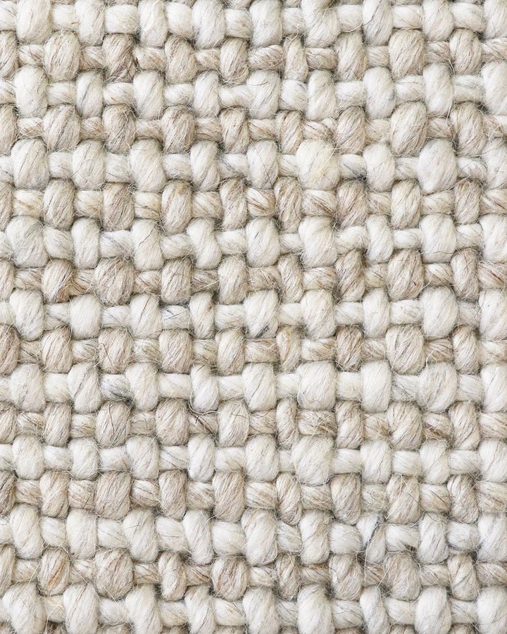 Kansas Floor Rug Bring a serene, welcoming feel to your home with the beauty of our Kansas floor rug. Handwoven in a two-tone blend of yarns, the simple 1-1 weave and soft oyster tones make this an easy choice for relaxed and minimal interiors. Australian