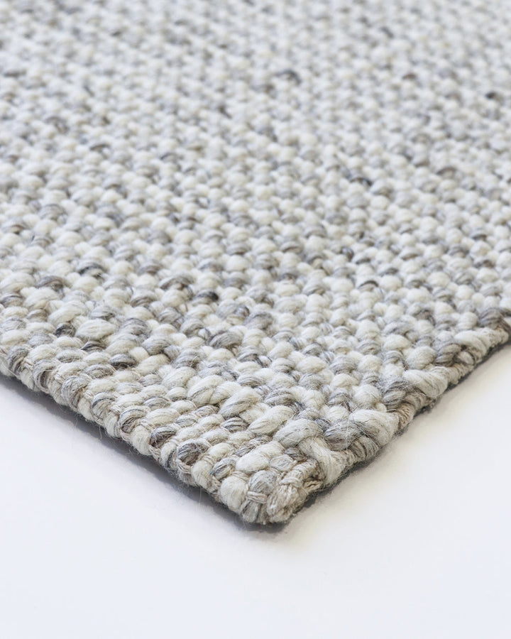 Kansas Floor Rug Bring a serene, welcoming feel to your home with the beauty of our Kansas floor rug. Handwoven in a two-tone blend of yarns, the simple 1-1 weave and soft oyster tones make this an easy choice for relaxed and minimal interiors. Australian