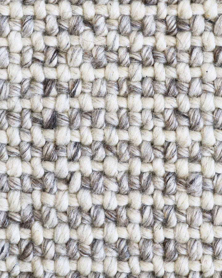 Kansas Floor Rug Bring a serene, welcoming feel to your home with the beauty of our Kansas floor rug. Handwoven in a two-tone blend of yarns, the simple 1-1 weave and soft oyster tones make this an easy choice for relaxed and minimal interiors. Australian