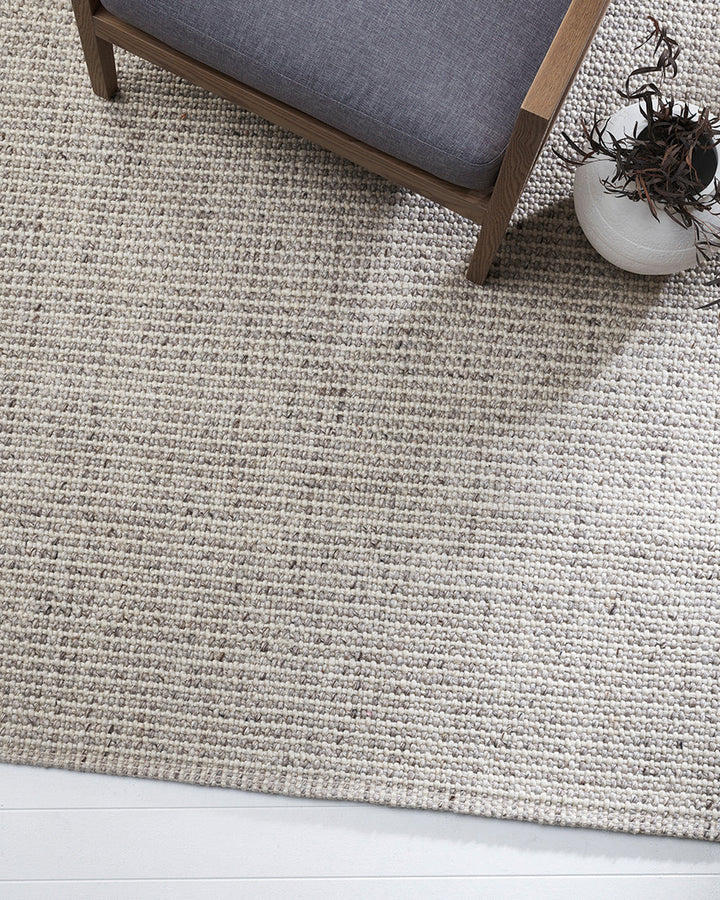 Kansas Floor Rug Bring a serene, welcoming feel to your home with the beauty of our Kansas floor rug. Handwoven in a two-tone blend of yarns, the simple 1-1 weave and soft oyster tones make this an easy choice for relaxed and minimal interiors. Australian