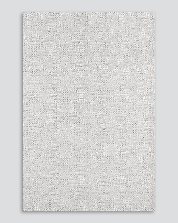 Kara Floor Rug Simplicity reigns supreme in this subtly patterned flatweave. Tightly woven from undyed wool and cotton, the neutral tone and refined pattern adds character while creating a light and relaxed feel. Australian Stock Buy at beon.com.au